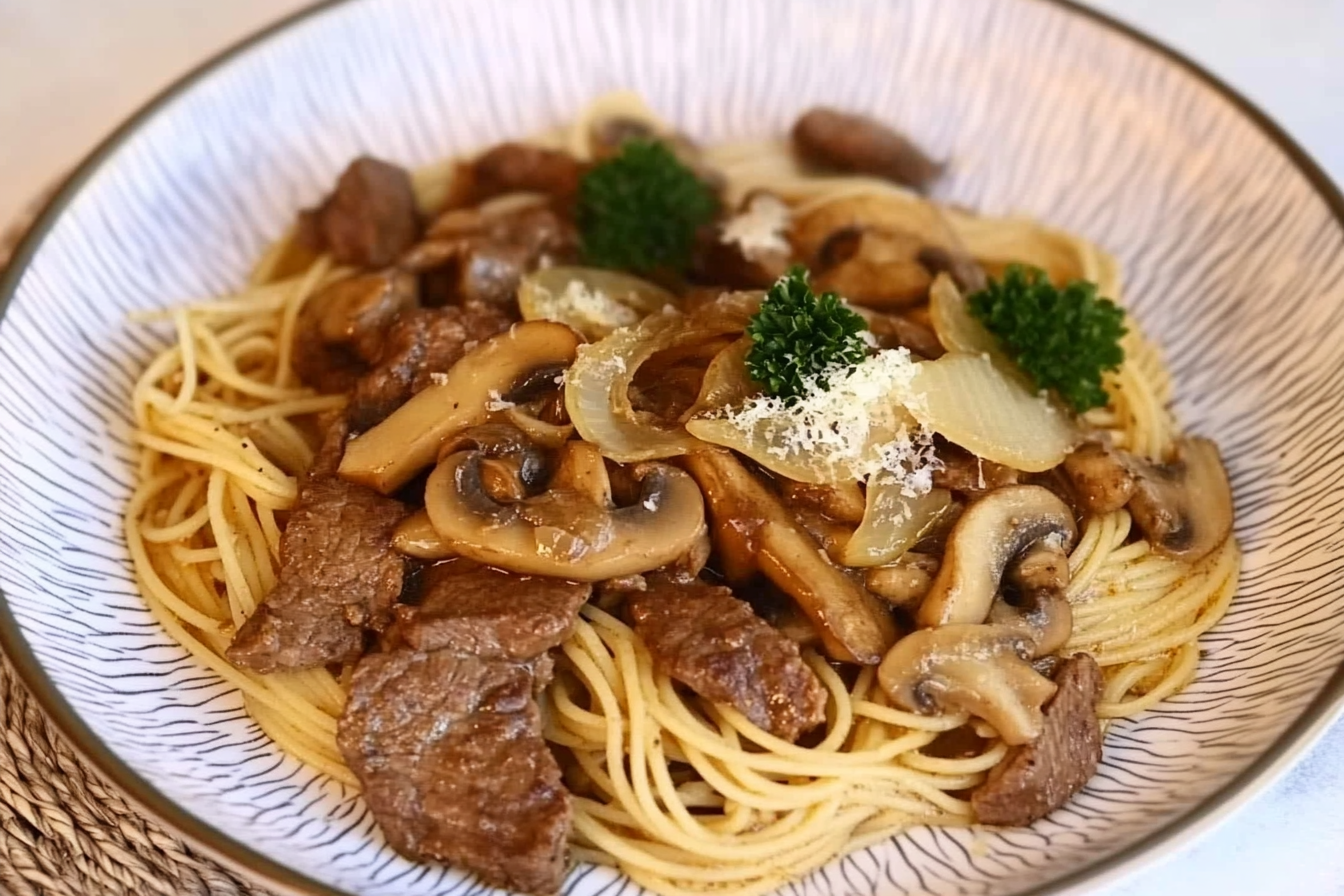Espaguetis con ternera y champiñones